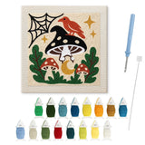 Contenu du kit punch needle amanite noire : toile sur cadre, aiguilles et fils de laine