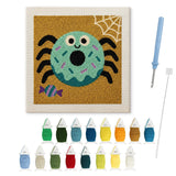 Contenu du kit punch needle araignée beignet : toile sur cadre, aiguilles et fils de laine