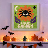 Tableau punch needle araignée sur sa fleur accroché au mur dans une déco d'Halloween