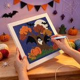 Broderie punch needle en cours sur la toile de l'arbre d'automne aux ailes noires