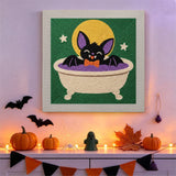 Tableau punch needle chauve-souris au bain accroché au mur dans une déco d'Halloween