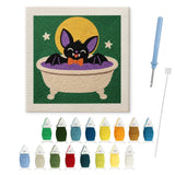 Contenu du kit punch needle chauve-souris : toile sur cadre, aiguilles et fils de laine