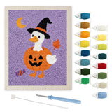 Contenu du kit punch needle canard potiron : toile sur cadre, aiguilles et fils de laine