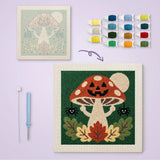 Toile imprimée numérotée à côté du tableau punch needle champignon aux araignées terminé