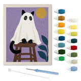 Contenu du kit punch needle chat au tabouret : toile sur cadre, aiguilles et fils de laine