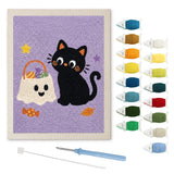Contenu du kit punch needle chat aux bonbons : toile sur cadre, aiguilles et fils de laine