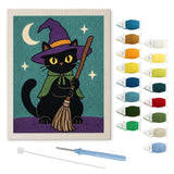 Contenu du kit punch needle chat cape verte : toile sur cadre, aiguilles et fils de laine