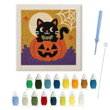 Contenu du kit punch needle chat citrouille : toile sur cadre, aiguilles et fils de laine