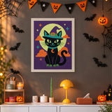 Tableau punch needle chat noir au chapeau turquoise accroché au mur dans une déco d'Halloween