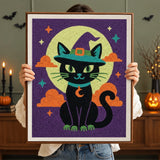 Tableau punch needle chat lune verte terminé tenu en main pour montrer sa taille