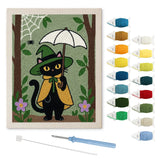 Contenu du kit punch needle chat parapluie : toile sur cadre, aiguilles et fils de laine