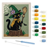 Contenu du kit punch needle chat sur souche : toile sur cadre, aiguilles et fils de laine