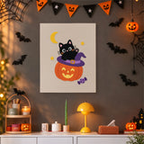 Tableau punch needle chaton sur citrouille accroché au mur dans une déco d'Halloween