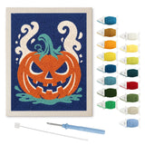 Contenu du kit punch needle citrouille rusée : toile sur cadre, aiguilles et fils de laine