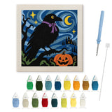 Contenu du kit punch needle corbeau : toile sur cadre, aiguilles et fils de laine