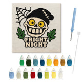 Contenu du kit punch needle crâne au bonnet : toile sur cadre, aiguilles et fils de laine