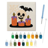Contenu du kit punch needle crâne bougies : toile sur cadre, aiguilles et fils de laine