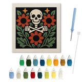 Contenu du kit punch needle crâne : toile sur cadre, aiguilles et fils de laine