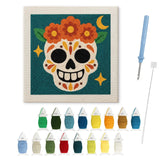 Contenu du kit punch needle crâne fleuri : toile sur cadre, aiguilles et fils de laine