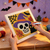 Broderie punch needle en cours sur la toile du crâne au chapeau violet