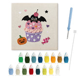 Contenu du kit punch needle Halloween cupcake : toile sur cadre, aiguilles et fils de laine