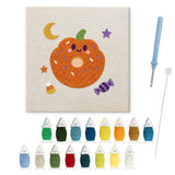 Contenu du kit punch needle Halloween donut : toile sur cadre, aiguilles et fils de laine