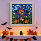 Tableau punch needle épouvantail au champ de maïs accroché au mur dans une déco d'Halloween