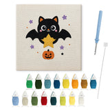 Contenu du kit punch needle Halloween chauve-souris : toile sur cadre, aiguilles et fils de laine