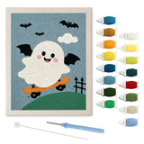 Contenu du kit punch needle fantôme acrobate : toile sur cadre, aiguilles et fils de laine