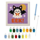 Contenu du kit punch needle fantôme ailé : toile sur cadre, aiguilles et fils de laine