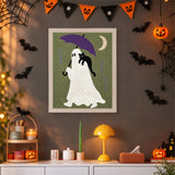 Tableau punch needle fantôme sous la pluie accroché au mur dans une déco d'Halloween