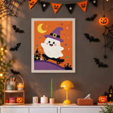 Tableau punch needle fantôme en skate et château hanté accroché au mur dans une déco d'Halloween