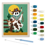 Contenu du kit punch needle fantôme cowboy : toile sur cadre, aiguilles et fils de laine