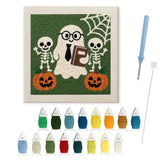 Contenu du kit punch needle fantôme et squelettes : toile sur cadre, aiguilles et fils de laine
