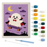 Contenu du kit punch needle vampire en skate : toile sur cadre, aiguilles et fils de laine