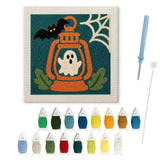 Contenu du kit punch needle fantôme lanterne : toile sur cadre, aiguilles et fils de laine