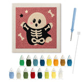 Contenu du kit punch needle Halloween fantôme osseux : toile sur cadre, aiguilles et fils de laine