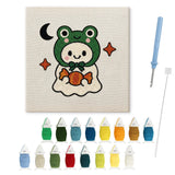 Contenu du kit punch needle fantôme grenouille : toile sur cadre, aiguilles et fils de laine