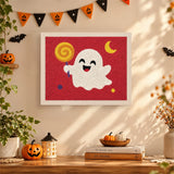Tableau punch needle fantôme à la grosse sucette accroché au mur dans une déco d'Halloween