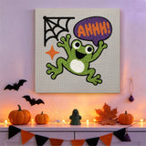 Tableau punch needle grenouille qui crie accroché au mur dans une déco d'Halloween
