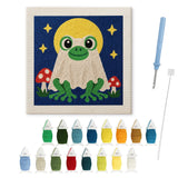 Contenu du kit punch needle grenouille lune : toile sur cadre, aiguilles et fils de laine