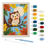 Contenu du kit punch needle hibou d'automne : toile sur cadre, aiguilles et fils de laine