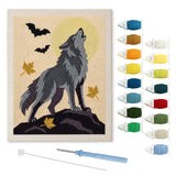 Contenu du kit punch needle loup hurlant : toile sur cadre, aiguilles et fils de laine