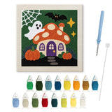 Contenu du kit punch needle maison amanite : toile sur cadre, aiguilles et fils de laine