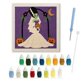 Contenu du kit punch needle mariée monstre : toile sur cadre, aiguilles et fils de laine