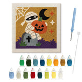 Contenu du kit punch needle momie Halloween : toile sur cadre, aiguilles et fils de laine