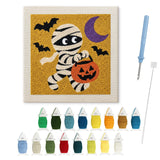 Contenu du kit punch needle momie en balade : toile sur cadre, aiguilles et fils de laine