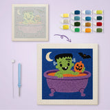 Toile imprimée numérotée et tableau punch needle monstre dans sa baignoire terminé