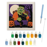 Contenu du kit punch needle monstre au chat : toile sur cadre, aiguilles et fils de laine