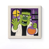 Punch Needle Halloween Monstre Chimiste : tableau brodé terminé sur son cadre